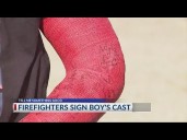 Columbus firefighters surprise boy by signing cast