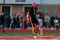 Photos: Divine Child football sweeps Ypsi Community for third straight shutout