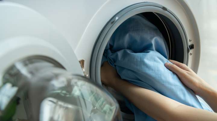 Stop Sheets From Balling Up — Here's The Right Way To Load Your Dryer