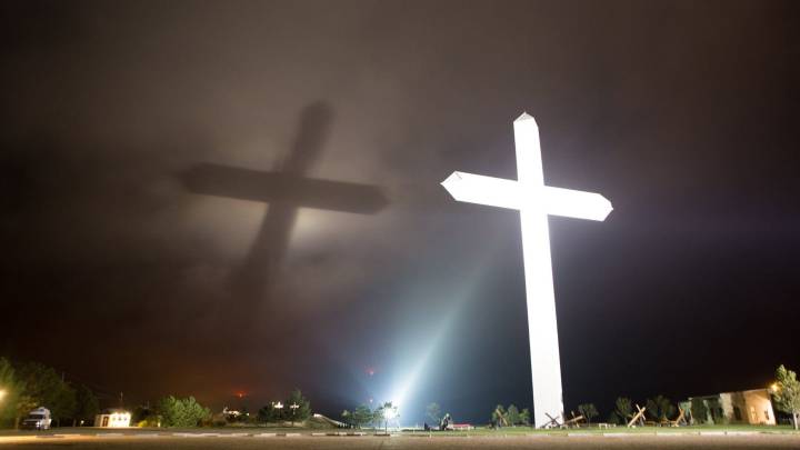Cross in Groom parking lot vandalized with message likely political