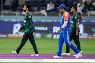 India chooses to bowl first against Pakistan in cricket’s Asia Cup final, no handshakes at toss