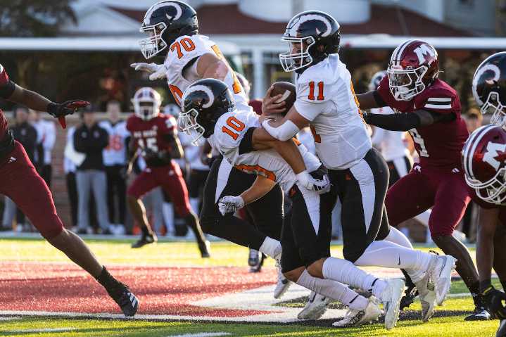 Rockford surges from behind to defeat Muskegon, spoiling Big Reds home opener. See photos