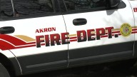 Pregnant woman assisted by neighbor to escape Akron house fire