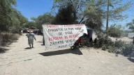 Suspenden bloqueos carreteros contra invernaderos Ecoterra y niegan represión en Chilac