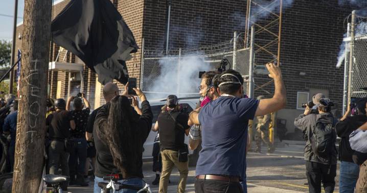 Three protesters arrested as demonstrators block vehicle at key immigration building near Chicago