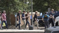 Authorities say student who had been radicalized fired revolver at Colorado school, wounding 2