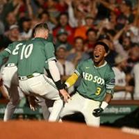 Rafaela hits walk-off triple as Red Sox book MLB playoff berth