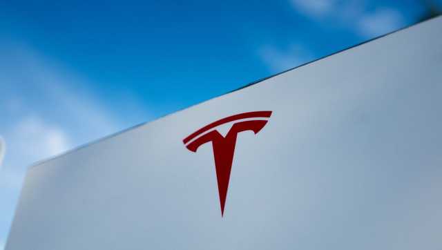 Tesla under investigation after parents say faulty door handles trapped their kids in the back