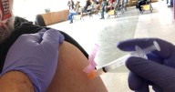 Arizona governor signs executive order helping keep COVID shots available to all residents