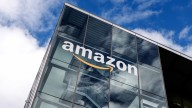 Amazon invests $1 billion to raise worker pay, lower health
