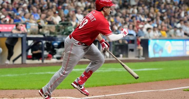 Reds on cusp of playoff berth after beating Brewers 7