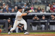 Yankees rally past White Sox 3-2, clinch playoff berth and close within 1 game of Toronto in AL East