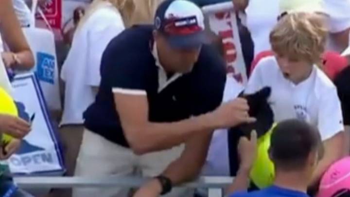 CEO apologizes for taking hat from boy at U.S. Open