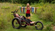 Teen who pushed her brother in wheelchair at every meet starts new chapter