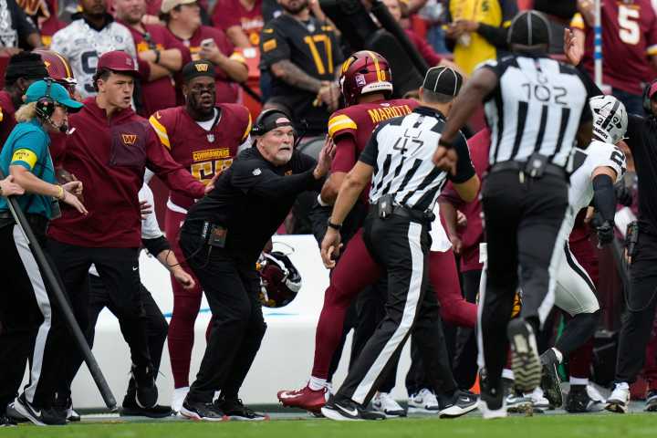 Commanders coach Dan Quinn bloodied in sideline collision with Marcus Mariota
