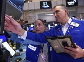 Wall Street drifts as tech stocks climb and oil prices sink