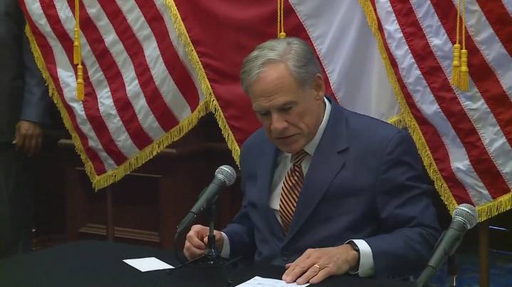 Protesters gather ahead of Governor Greg Abbott's State of the State luncheon in Waco