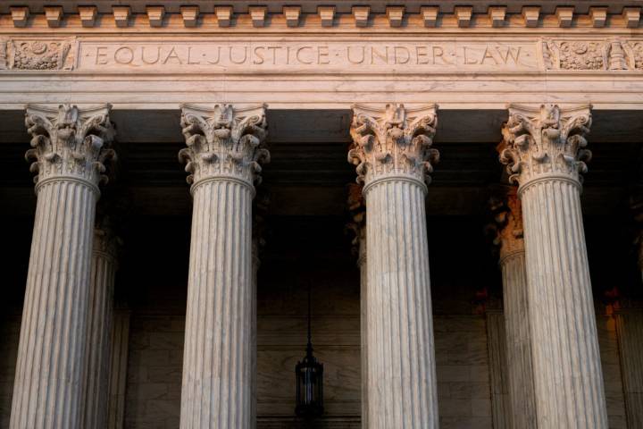 Chief justice keeps Trump funding freeze in place for now