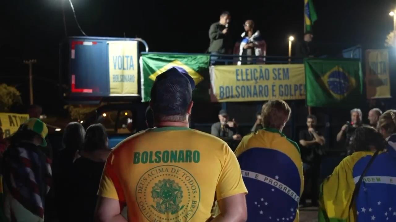 Supporters of former Brazilian president Jair Bolsonaro pray ahead of his trial