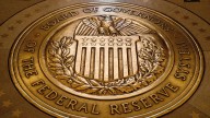 Federal Reserve cuts key rate by quarter-point and signals two more cuts this year