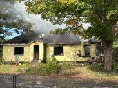 Central NY home catches fire after blaze set to clear brush spreads out of control