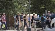 Authorities say student who had been radicalized fired revolver at Colorado school, wounding 2