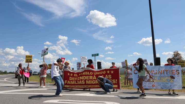Activists gather to protest Thursday's ICE operation at Hyundai megasite