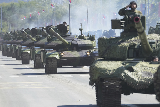 Serbia stages a large military parade to showcase tanks, jets and missile systems
