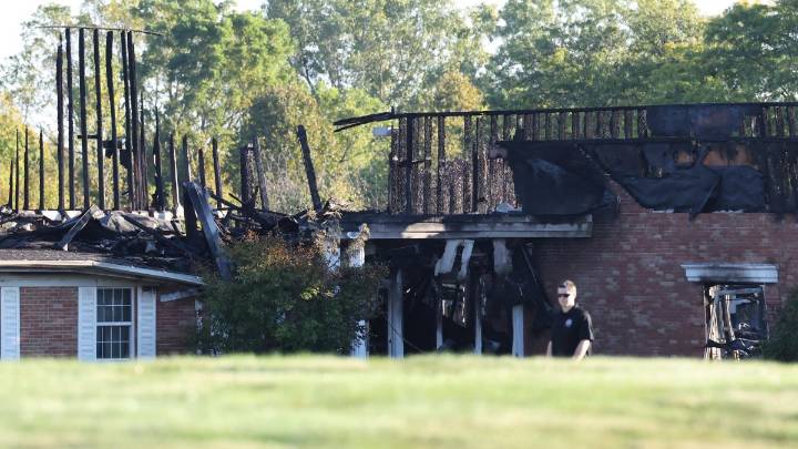 Police seek motive in Michigan church shooting and fire