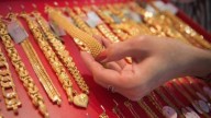 Gold, silver drop from record peak on profit taking, Powell remarks weigh on metals