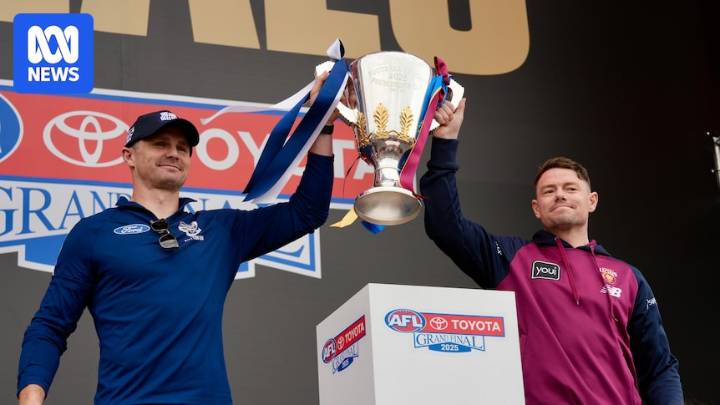 Passionate Geelong and Brisbane fans cheer on their premiership teams at grand final eve parade at MCG