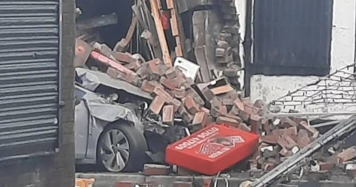 Man rushed to hospital after car crushed with bricks in horror takeaway crash