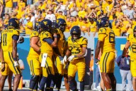 Notebook: Rodriguez looking for inexperienced tailbacks to step up; Robinson practicing, but status for Saturday remains unsure