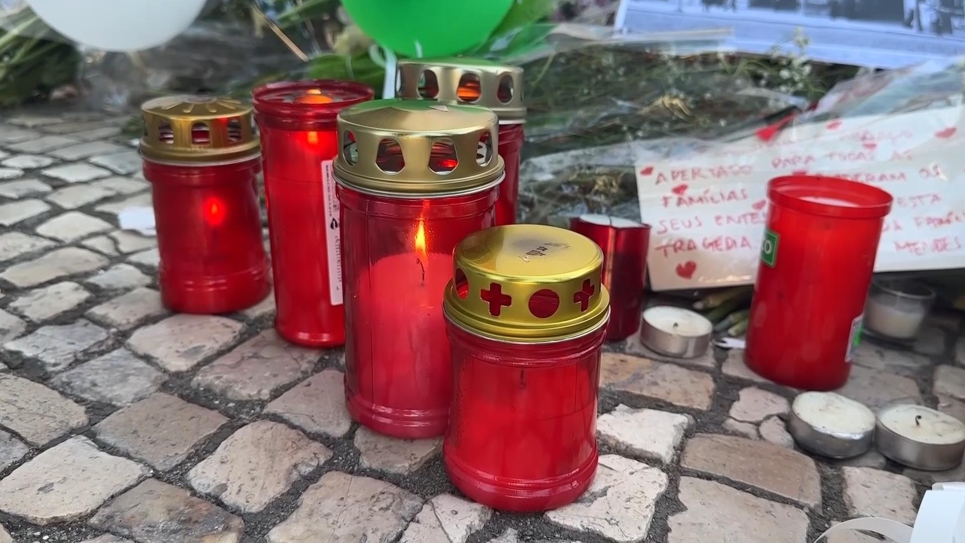 Locals and tourists place tributes near site of deadly streetcar crash in Lisbon
