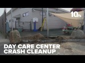 Clean up continues after car smashed through fence at day care center