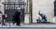 Banksy artwork showing judge beating protester appears on London, U.K. court wall
