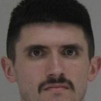 Dallas FedEx worker charged after hammer and gun attack on co