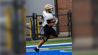 Penn's Vinny Freeman is a big hit both on the gridiron and the wrestling mat