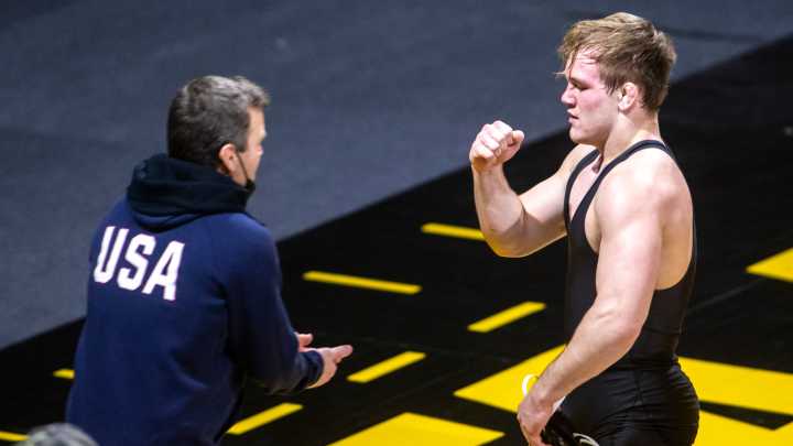 Terry Brands coaches with son Nelson at Iowa City youth wrestling club