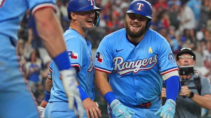 Burger, Jung get to Valdez as Rangers beat Astros 4-2 to keep pace in AL wild card