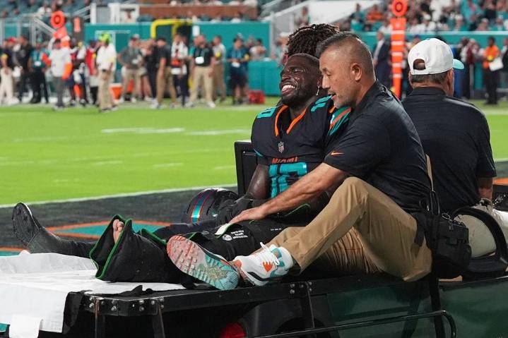 Dolphins’ Tyreek Hill carted off field, hospitalized with leg injury
