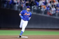 Mets' catcher 'doesn't have time' to think about pain and is focusing on two things: 'Play and win'