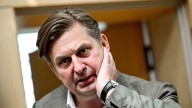German parliament lifts immunity of a prominent far-right lawmaker and police search his home