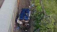 Ten dead after freight train smashes into bus making last