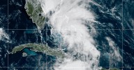 Tropical Storm Imelda forms alongside Hurricane Humberto, both expected to turn away from US