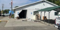 Pick-up trucks drives through Gooding Senior Center