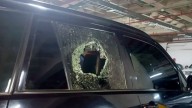 Convoy carrying Ecuadorian president attacked during protests, officials say
