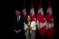 Minister of Foreign Affairs Anita Anand and Minister of National Defence David McGuinty respond to questions at the Liberal caucus meeting in Edmonton on Wednesday. Anand reiterated that Canada saw Is