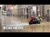 Watch: Firefighters slog through waist-high floodwaters near Milan