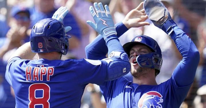 Happ homers as Cubs clinch first postseason berth since 2020